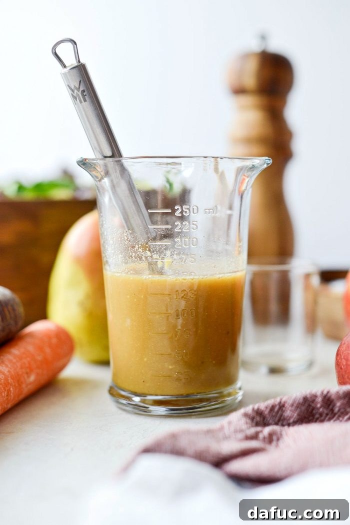 Golden Autumn Salad with Sweet and Savory Maple Bacon Vinaigrette 8 whisked ingredients in glass measuring cup