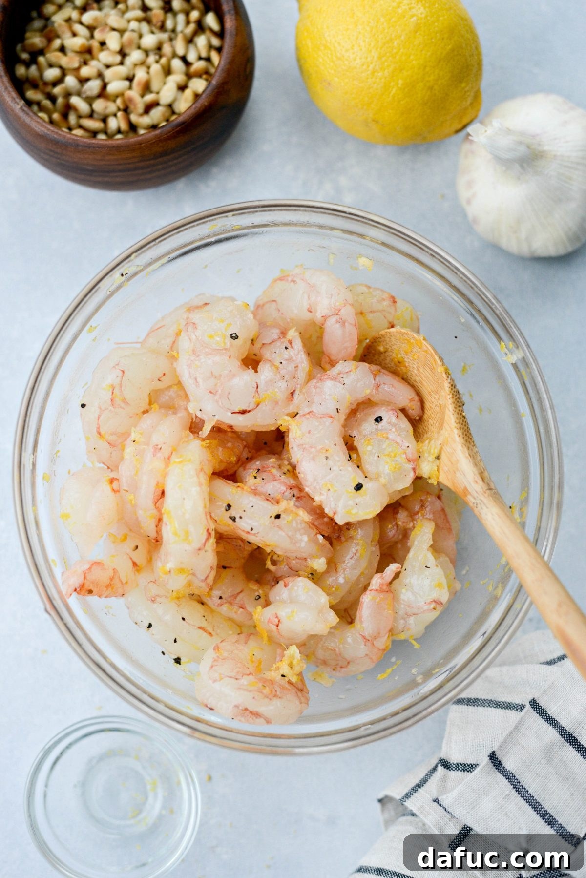 toss shrimp with oil, garlic, lemon zest and salt and pepper