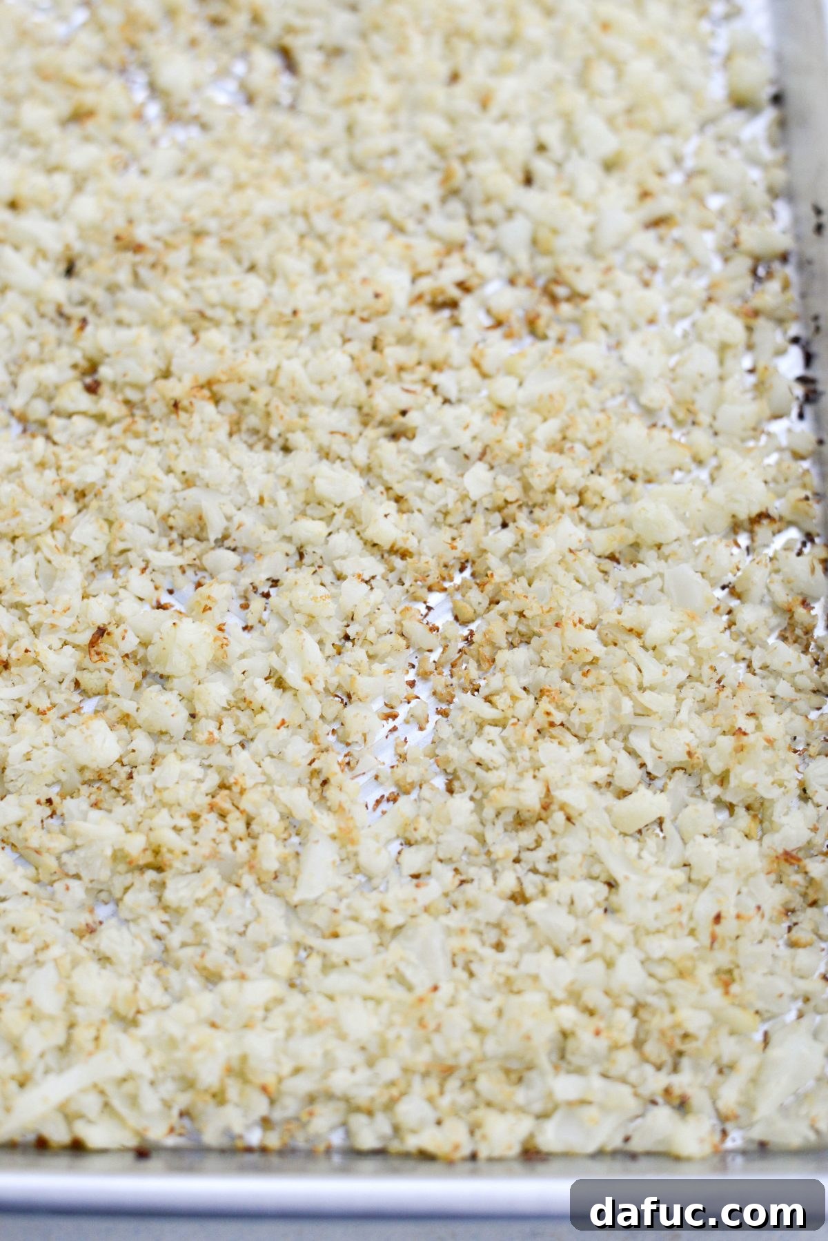 Crisp Roasted Cauliflower Grains 9 Perfectly golden roasted cauliflower rice in a pan