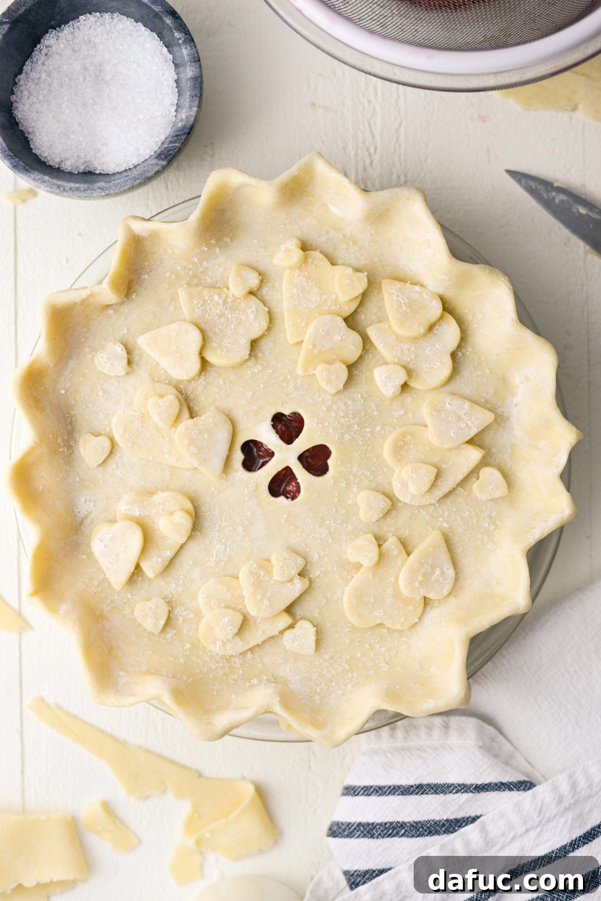 Decorating cherry pie with dough scraps is optional