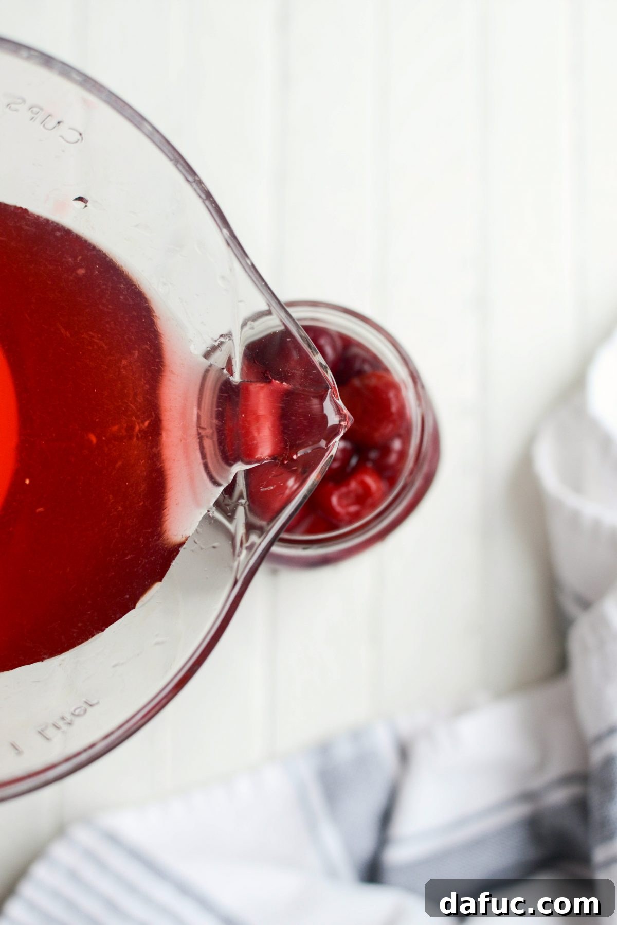 Naturally Crafted Maraschino Cherries 13 Pouring cherry syrup over cherries in a jar