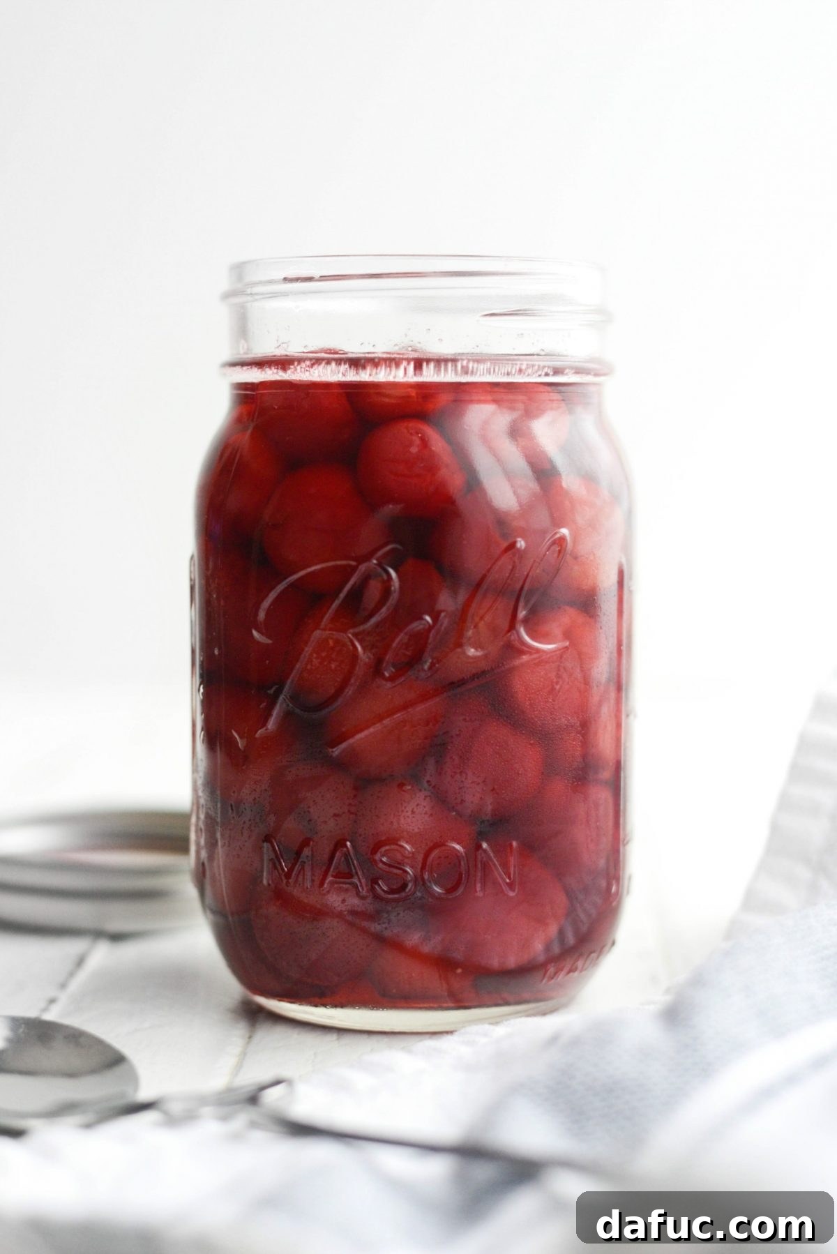 Naturally Crafted Maraschino Cherries 15 Homemade Maraschino Cherries in a jar with spoon