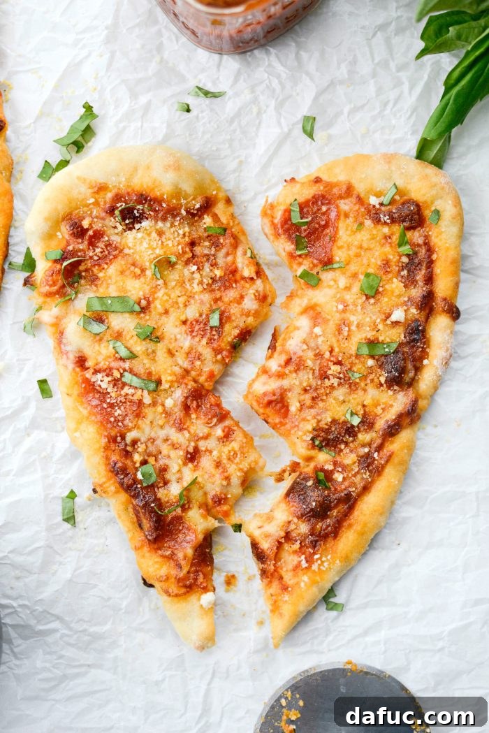 Sweetheart Pizza Treats 18 A sliced Heart Shaped Personal Pizza, showing the delicious layers inside
