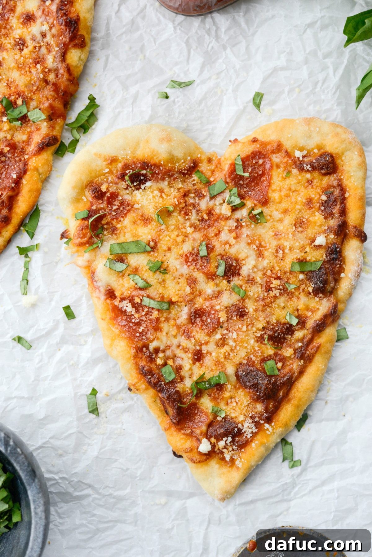 Sweetheart Pizza Treats 3 Close-up of freshly baked Heart Shaped Personal Pizzas topped with mozzarella and pepperoni