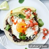 Huevos Rancheros, a classic Mexican breakfast dish, as featured on SimplyScratch.com