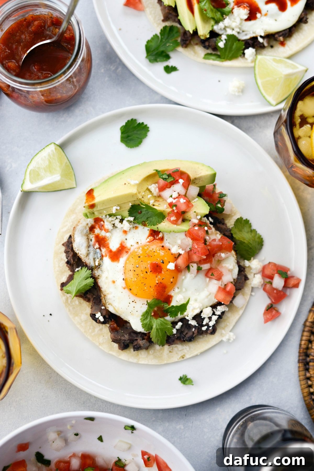 Prepared Huevos Rancheros with hot sauce drizzled over the top