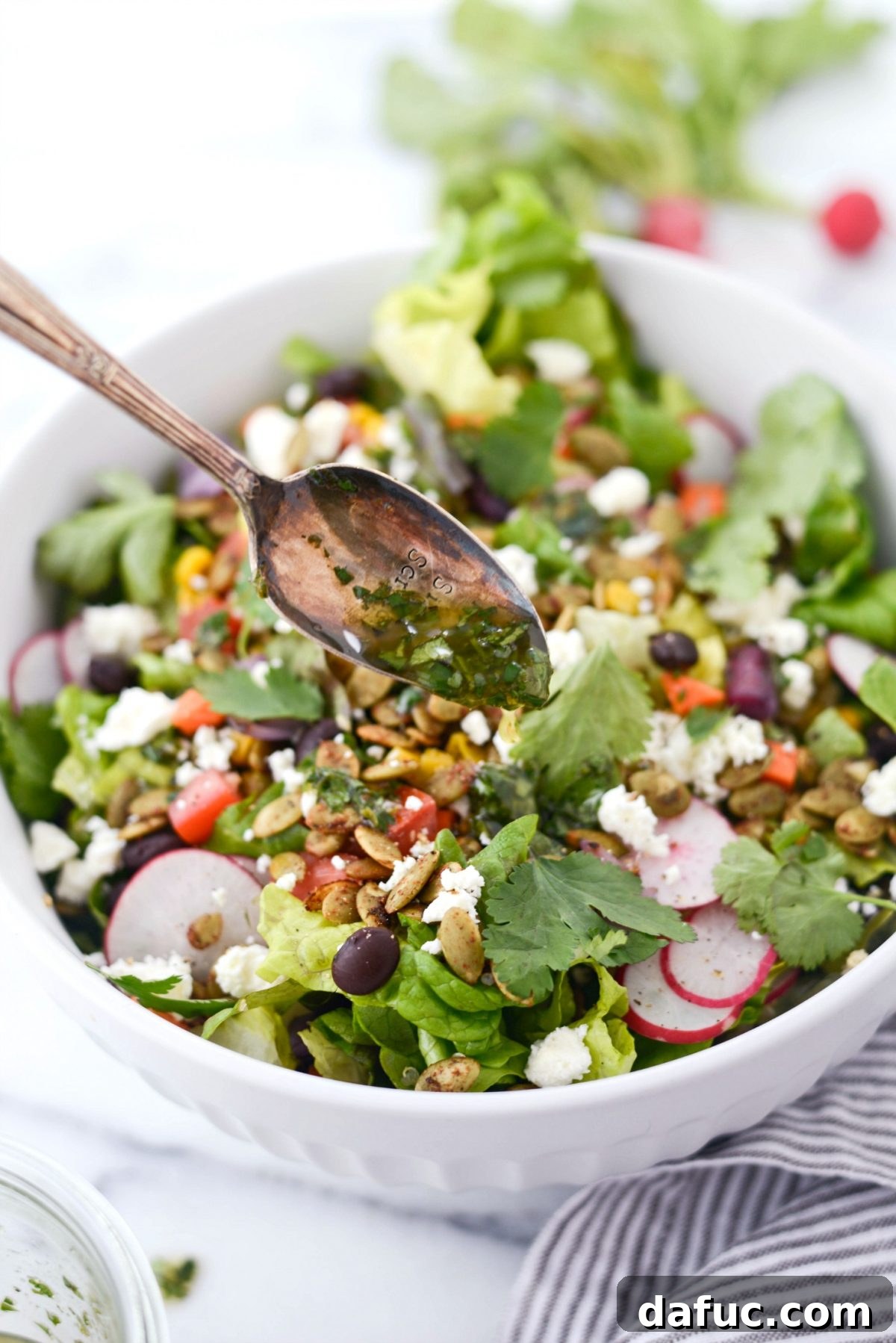 Executive Chop Salad 11 Drizzling cilantro lime vinaigrette over the salad