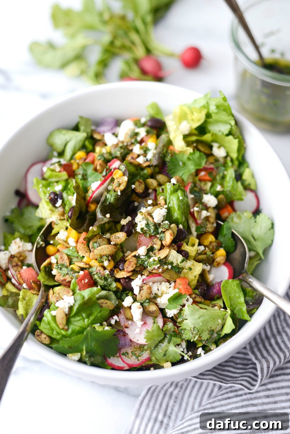 Executive Chop Salad 3 Honcho Chop Salad served in a large bowl with serving spoons