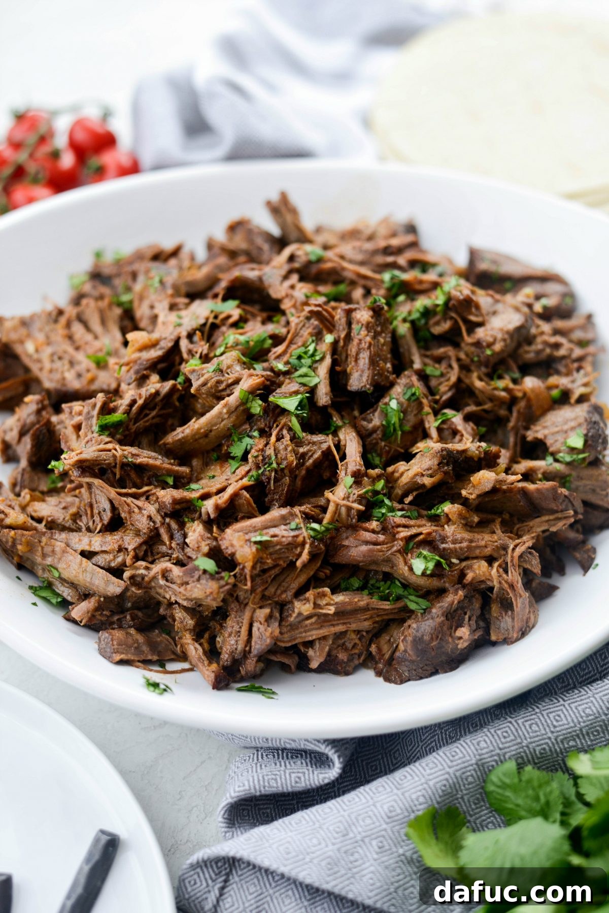 Fall-Apart Tender Slow Cooker Beef Barbacoa 19 An inviting overhead shot of Slow Cooker Beef Barbacoa, ready to be portioned and enjoyed.