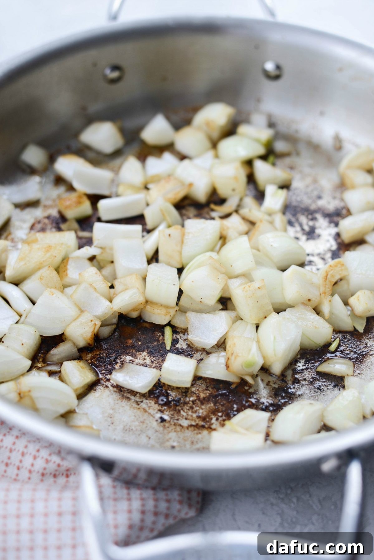 Fall-Apart Tender Slow Cooker Beef Barbacoa 9 Diced sweet onions gently sautéing in the same skillet used for searing, releasing delicious aromas.