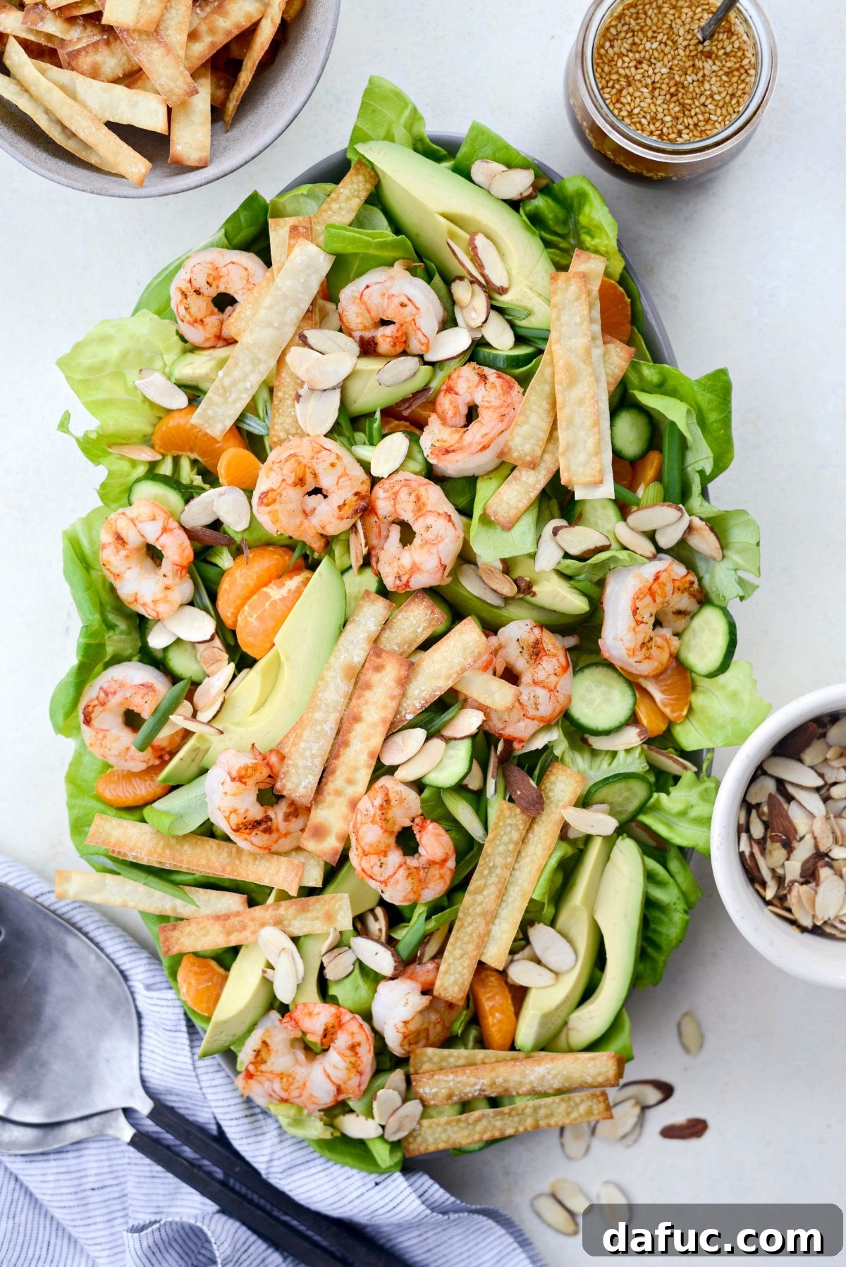 Flame-Kissed Shrimp Salad with Asian Zing and Wonton Crunch 11 Grilled Asian Shrimp Salad with Crispy Wontons on platter.