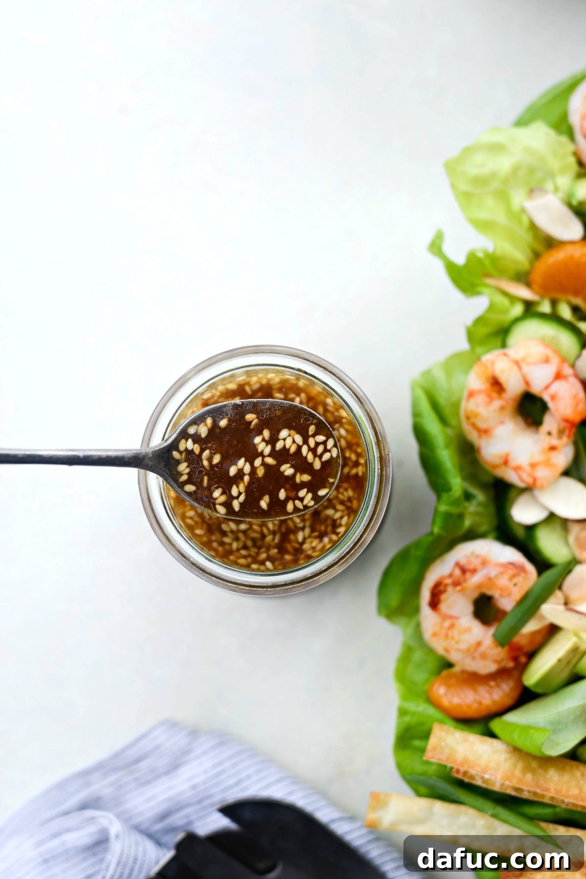 Flame-Kissed Shrimp Salad with Asian Zing and Wonton Crunch 12 drizzle salad with toasted sesame dressing