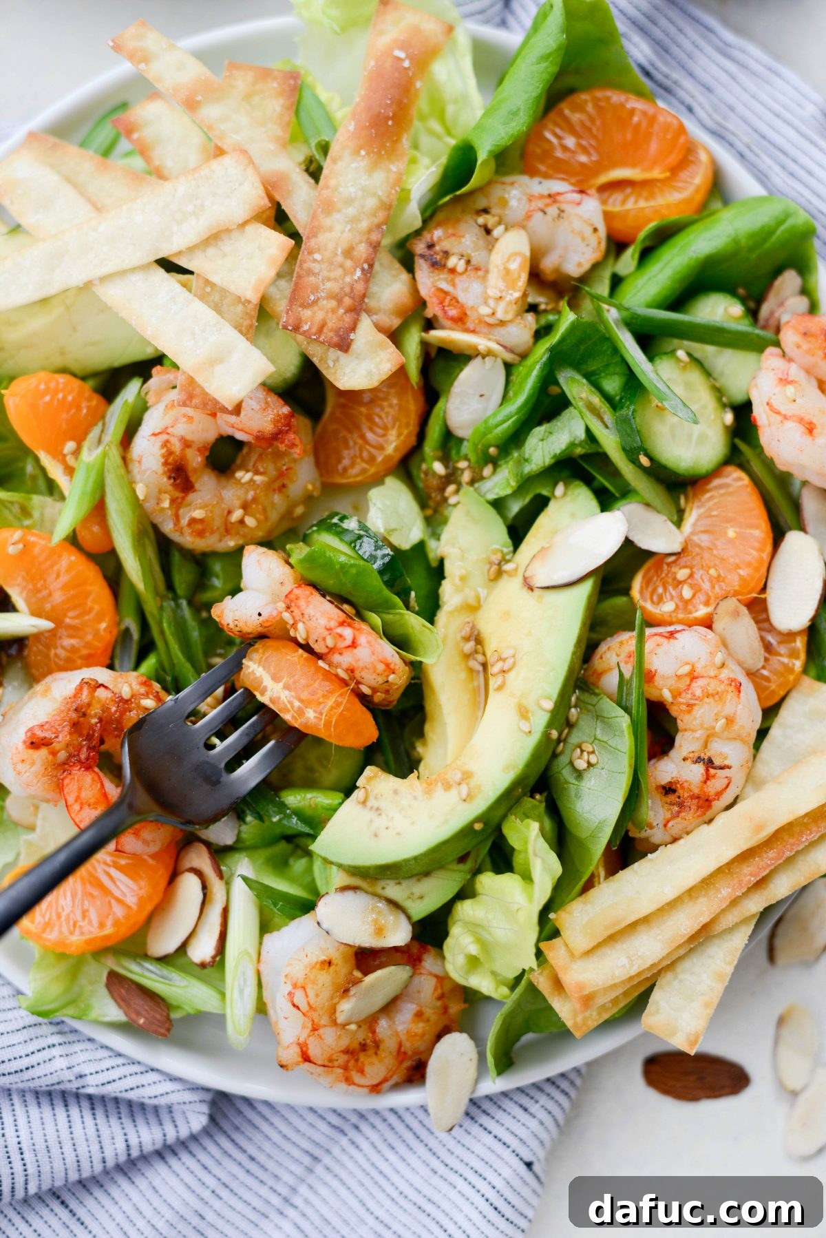 Flame-Kissed Shrimp Salad with Asian Zing and Wonton Crunch 15 forkful of Grilled Asian Shrimp Salad with Crispy Wontons