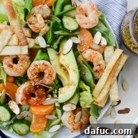 Grilled Asian Shrimp Salad with Crispy Wontons l SimplyScratch.com #shrimp #asian #salad #crispy #wonton #mandarin #oranges #toastedsesame #dressing #avocado