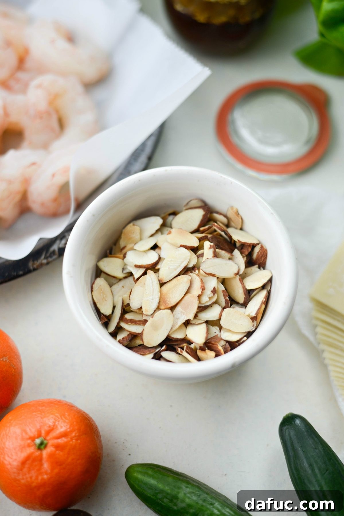 Flame-Kissed Shrimp Salad with Asian Zing and Wonton Crunch 7 bowl of toasted sliced almonds