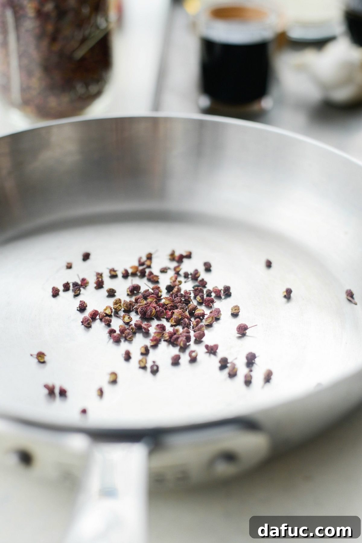 Szechuan Peppercorns in a skillet ready for toasting