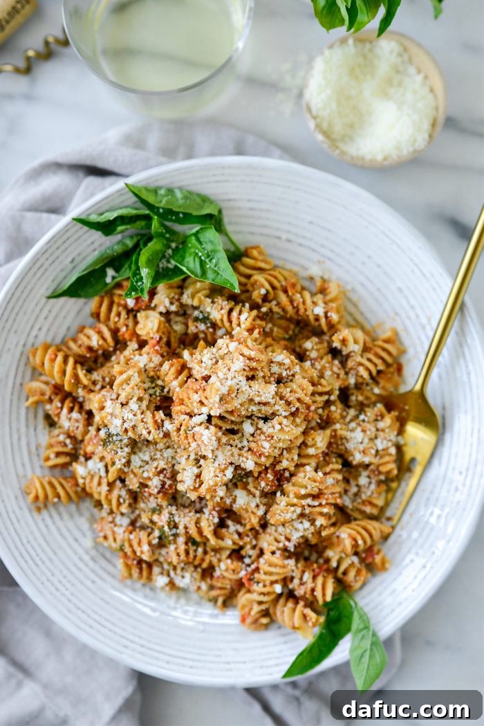 Golden Walnut & Sun-dried Tomato Pesto Pasta 16 Plated Sun-dried Tomato Toasted Walnut Pesto Pasta garnished with fresh basil and grated cheese