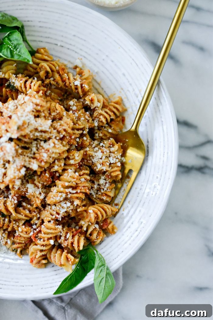 Golden Walnut & Sun-dried Tomato Pesto Pasta 18 Close-up of the textured Sun-dried Tomato Walnut Pesto Pasta in a serving bowl