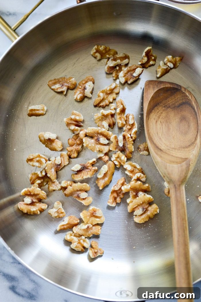 Golden Walnut & Sun-dried Tomato Pesto Pasta 5 Walnuts being toasted in a dry pan over medium heat