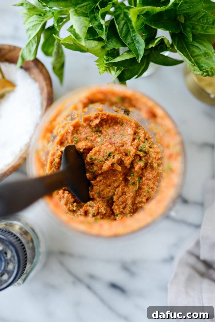 Golden Walnut & Sun-dried Tomato Pesto Pasta 10 Close-up of vibrant red Sun-dried Tomato Walnut Pesto blended to a thick, smooth consistency