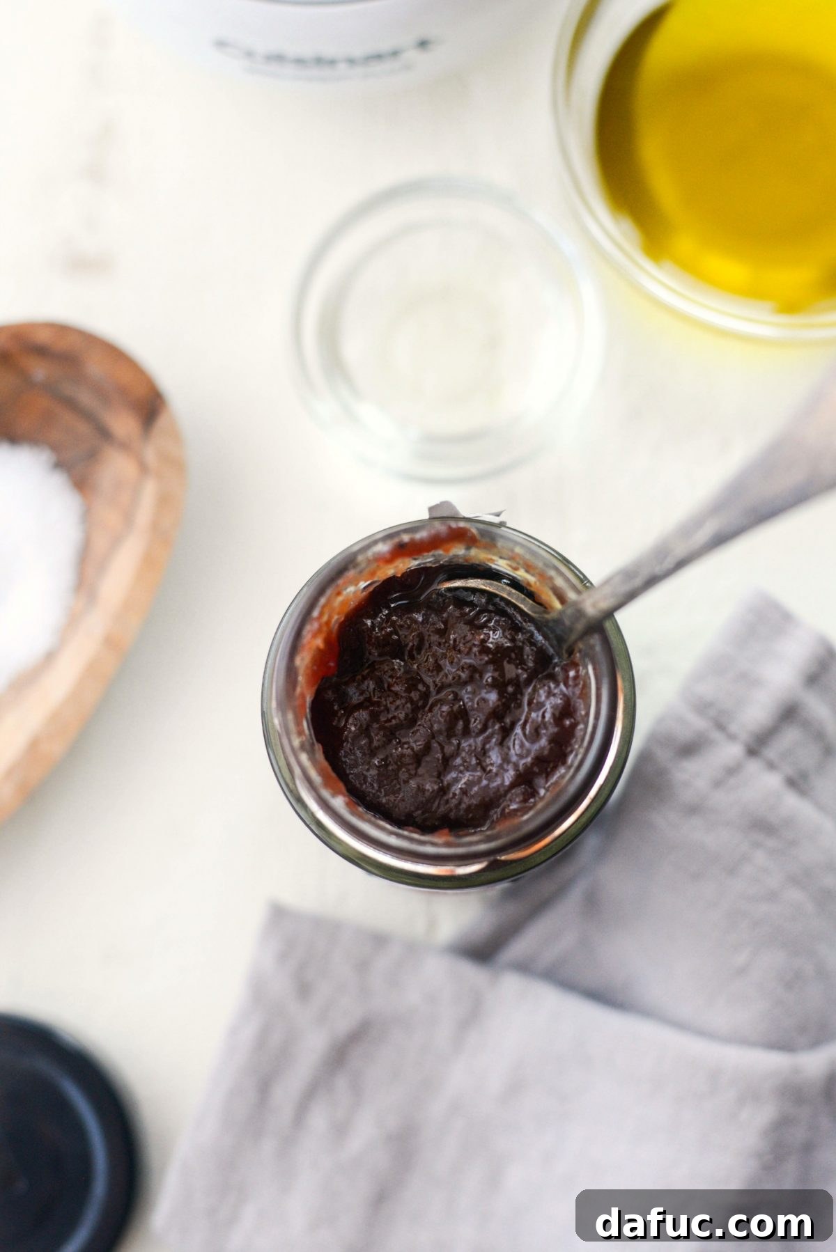 Pomegranate Jam Vinaigrette in a small bowl with a whisk