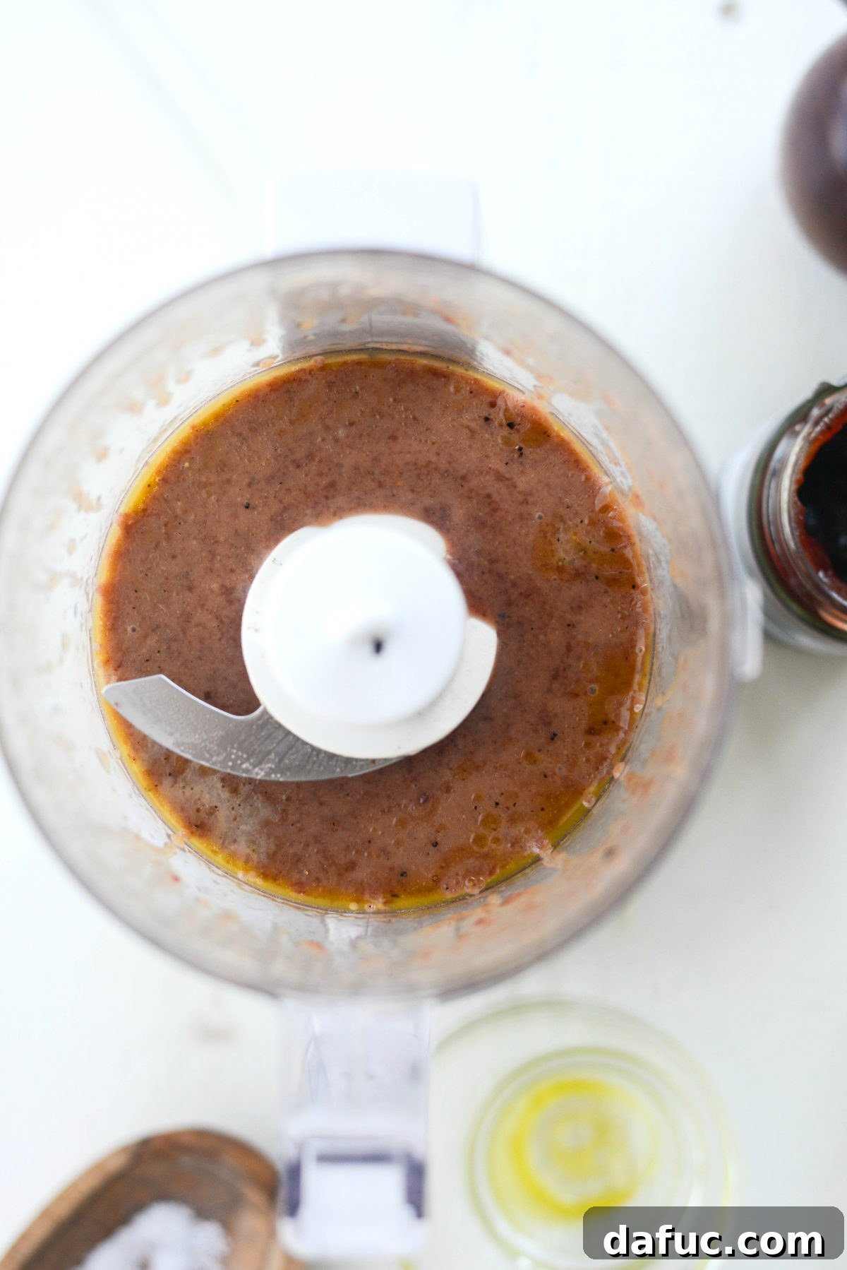Blended Pomegranate Jam Vinaigrette in a mini food processor