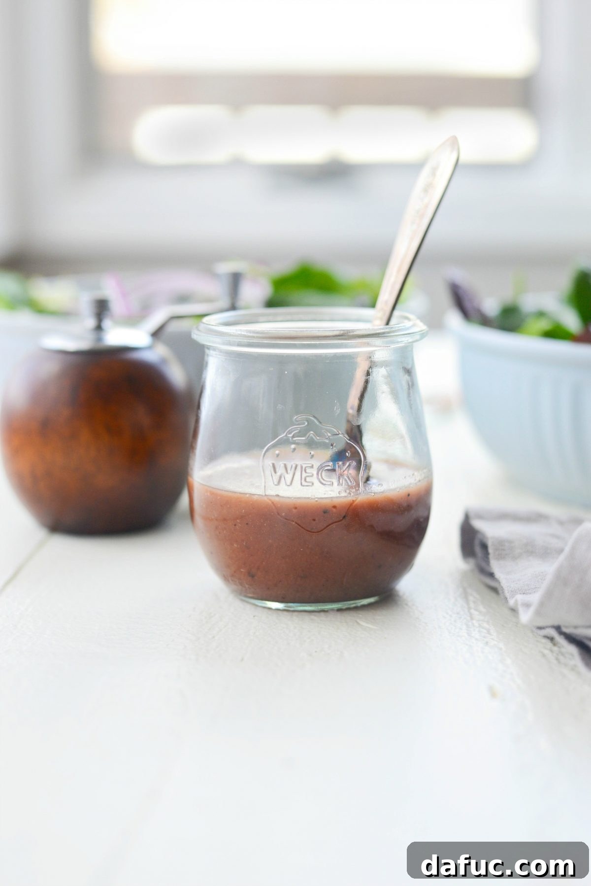 Pomegranate Jam Vinaigrette in a jar, ready for serving