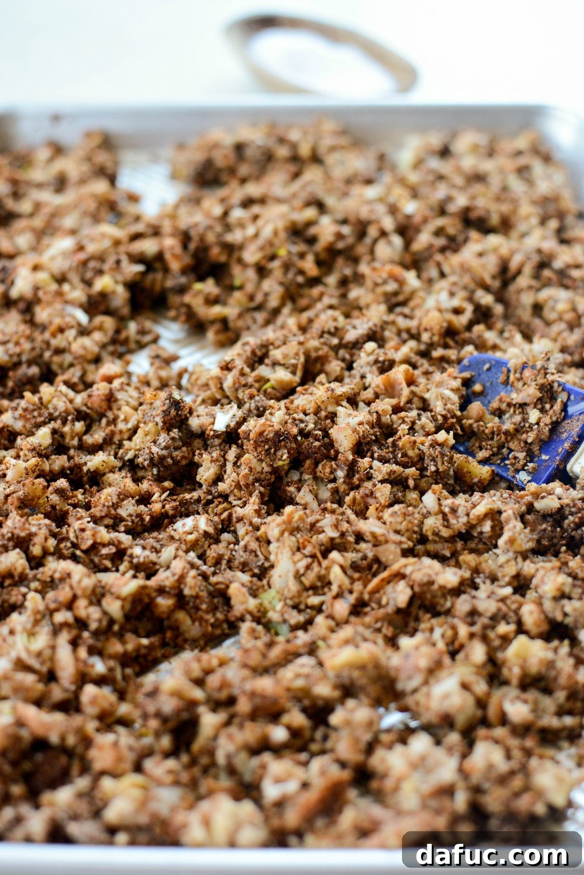 Combined vegan chorizo mixture spread evenly on a baking sheet