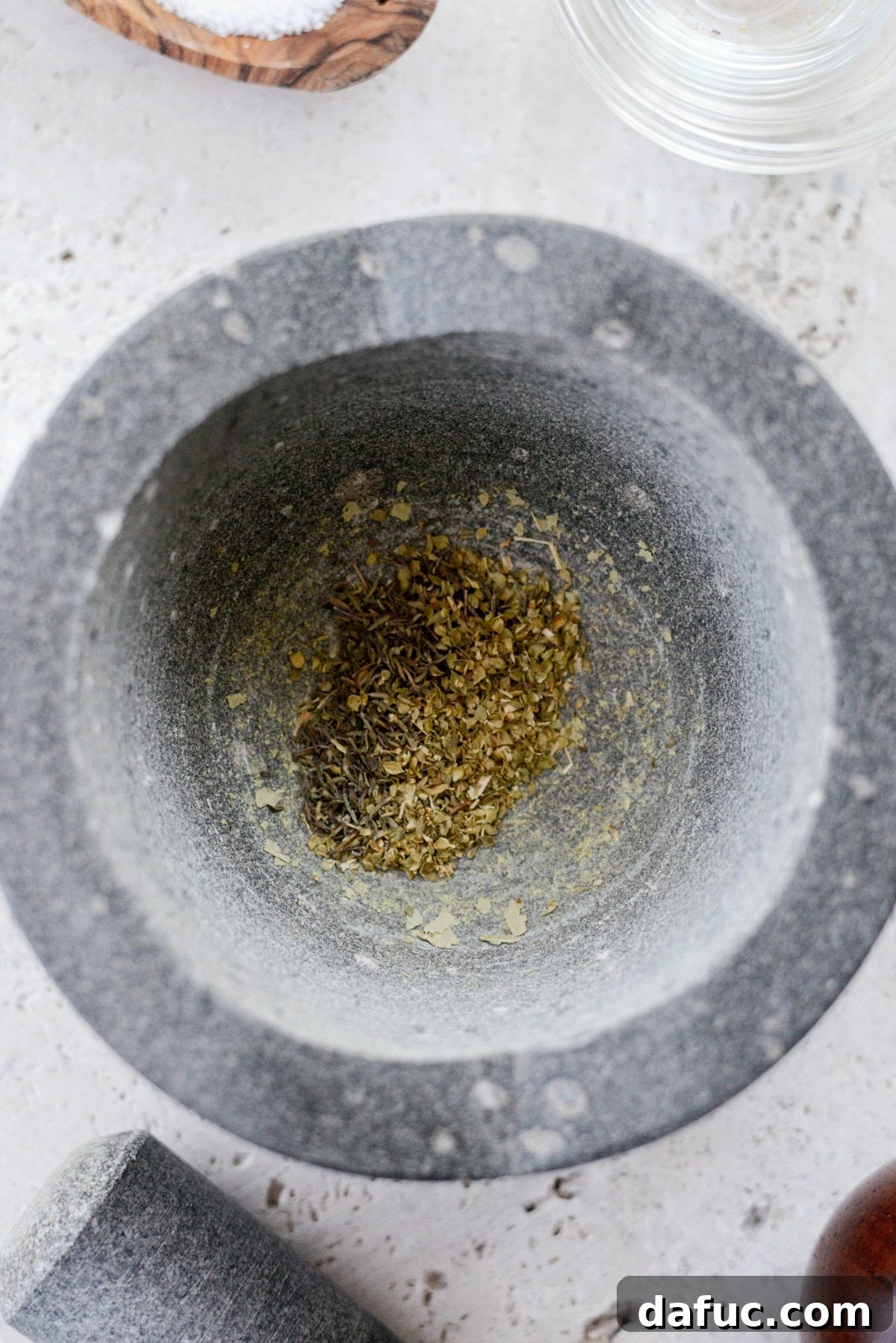 Smoky Chorizo Seasoning 5 Mortar and pestle grinding bay leaf