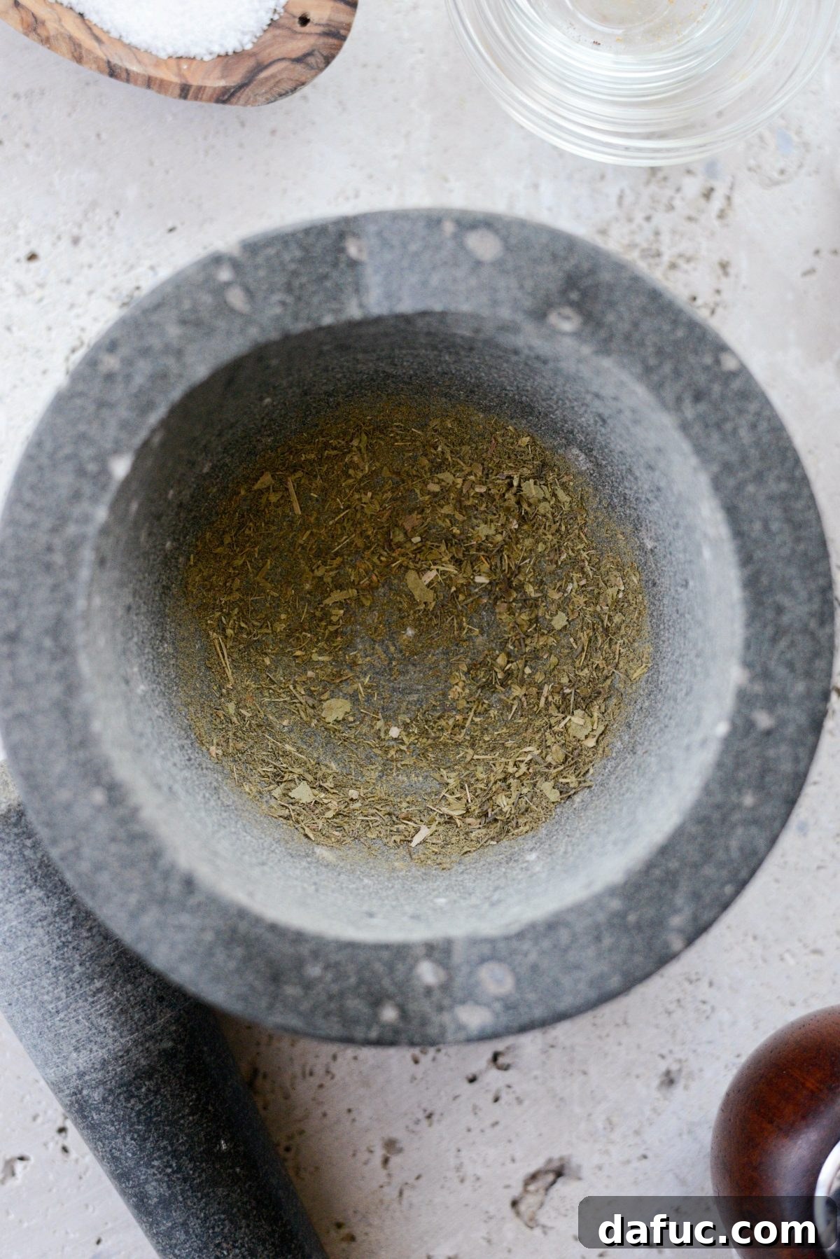 Grinding spices with mortar and pestle for fresh Chorizo Blend