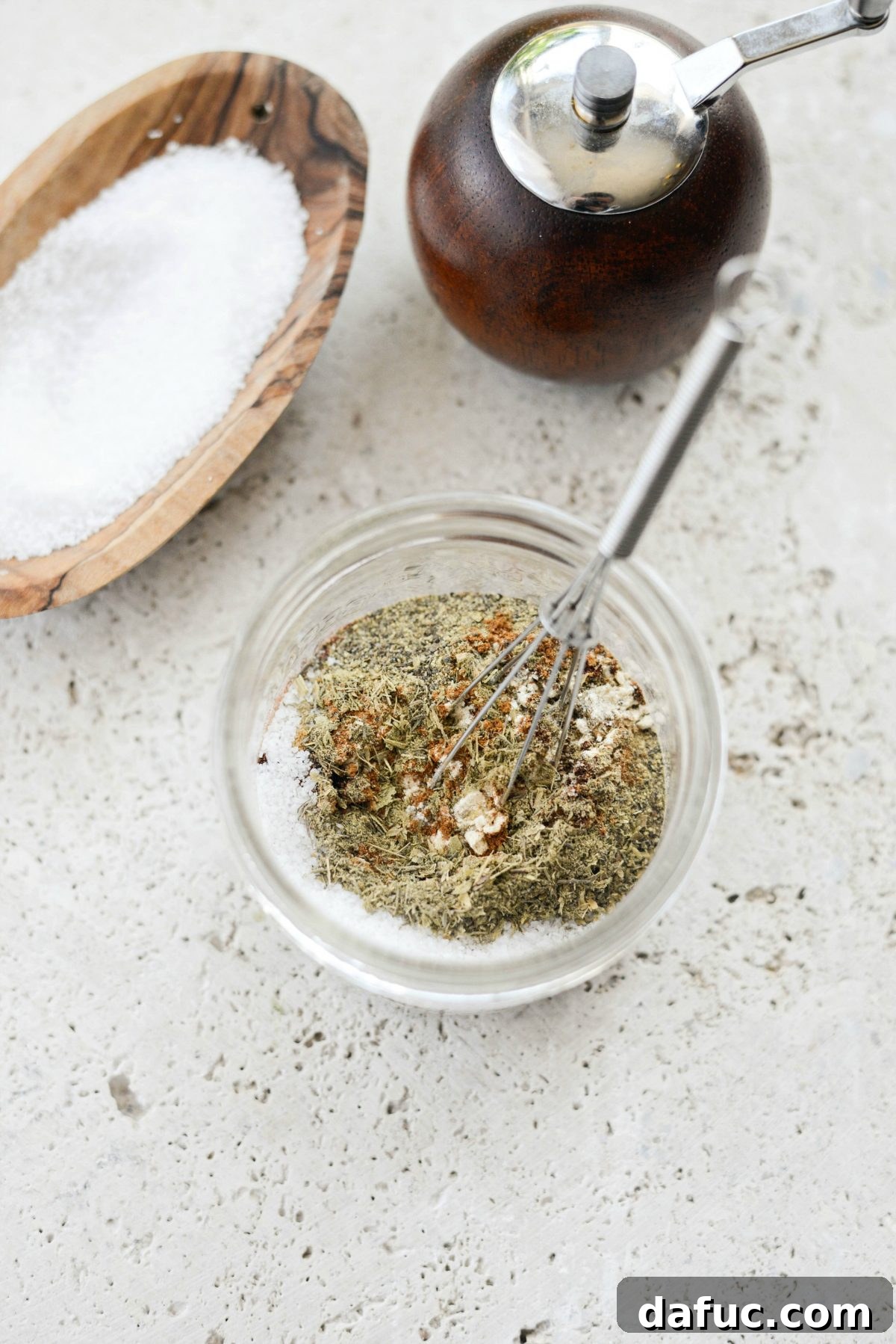 Whisking homemade Chorizo Seasoning for even flavor distribution