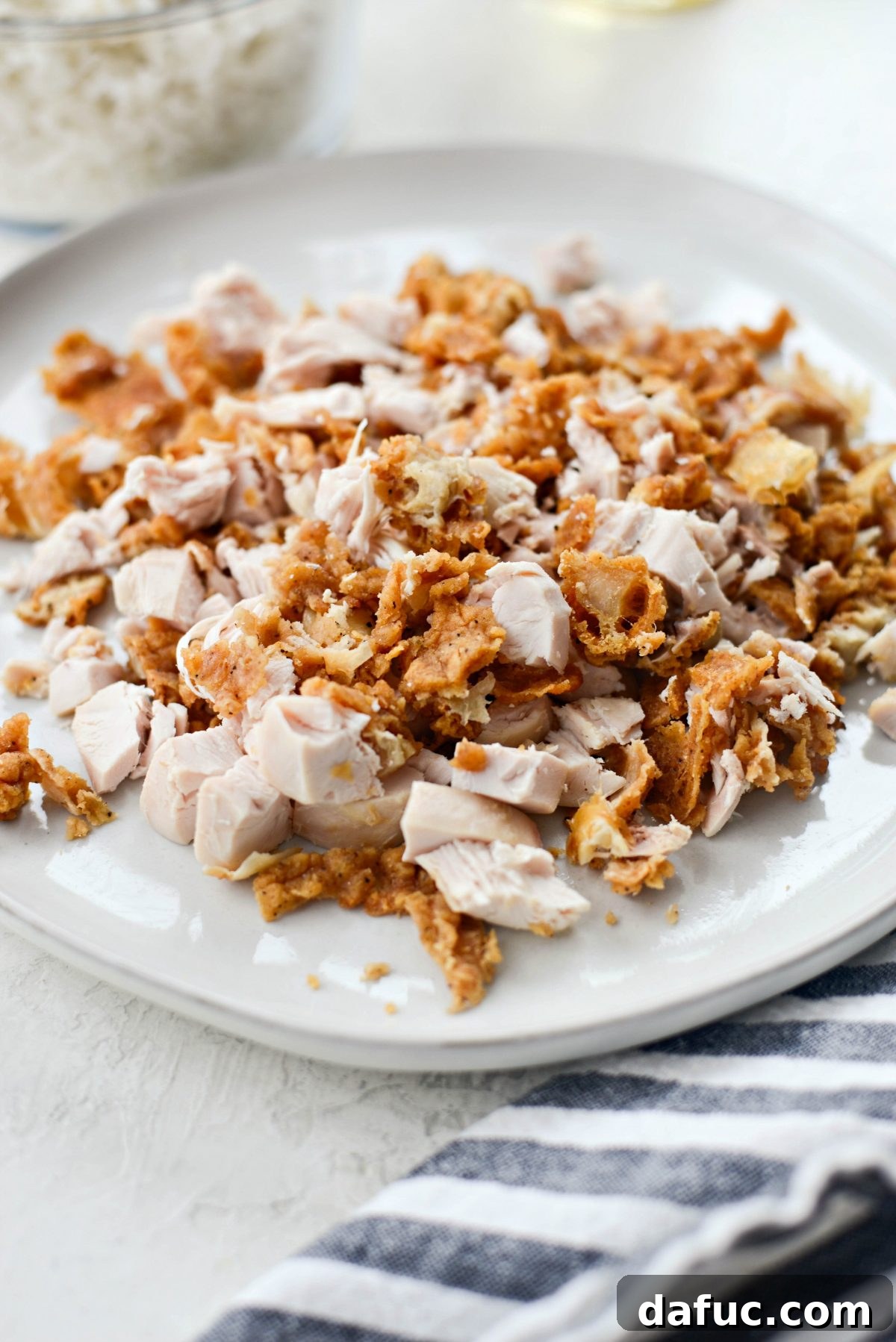 chopping up fried chicken for fried rice