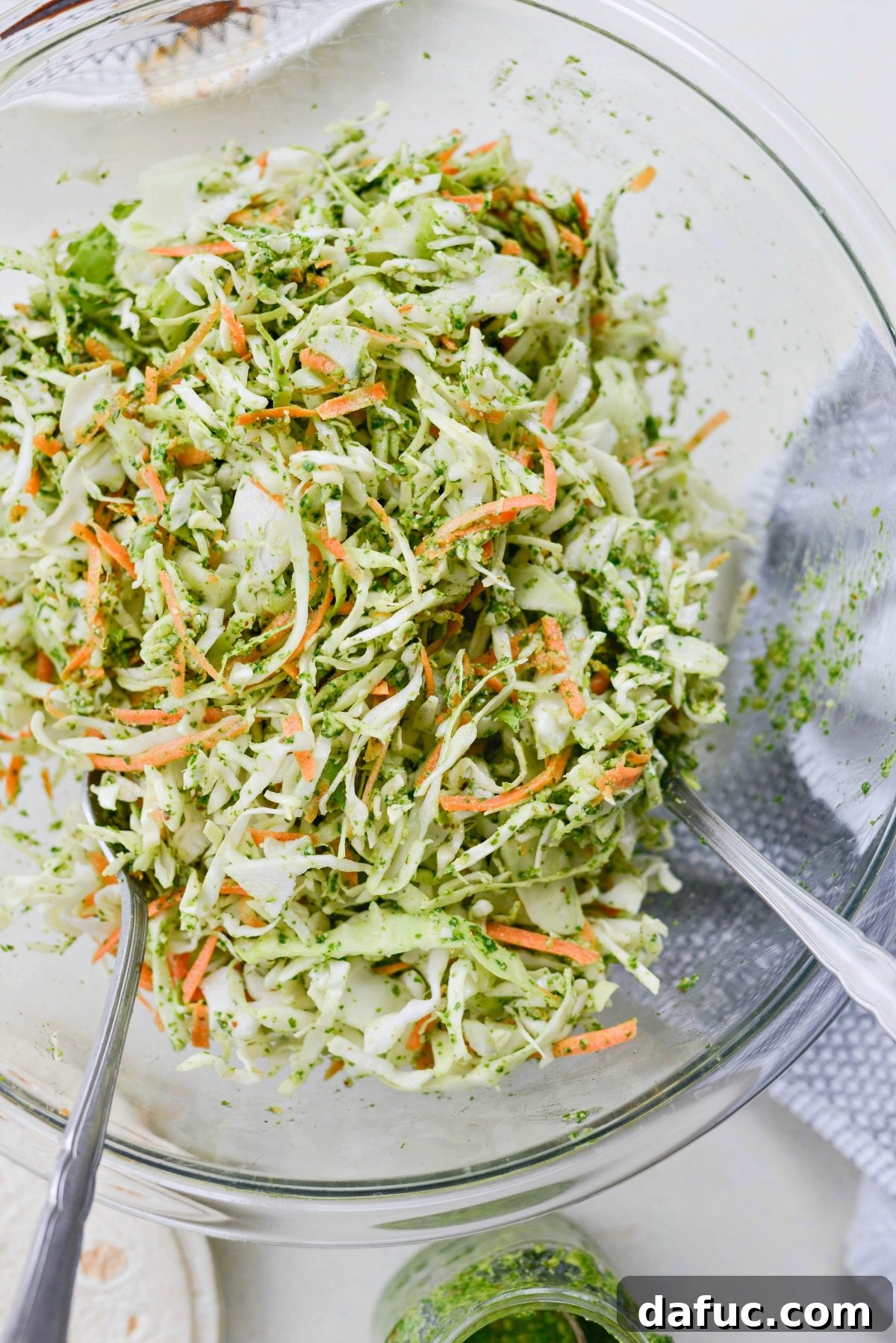 Refreshing cilantro pesto slaw, perfectly tossed and ready for tacos.