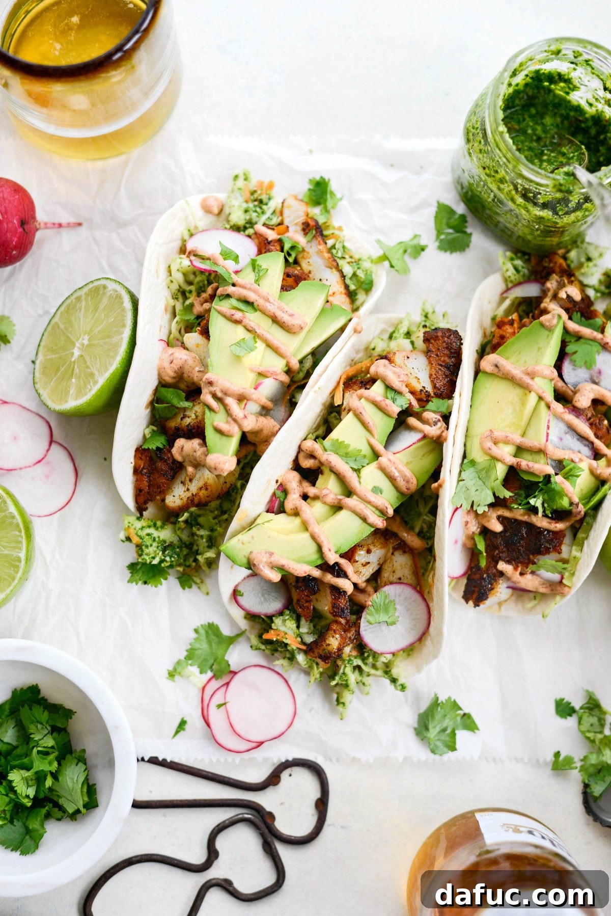 An overhead shot of multiple Blackened Fish Tacos arranged artfully, ready to be served.