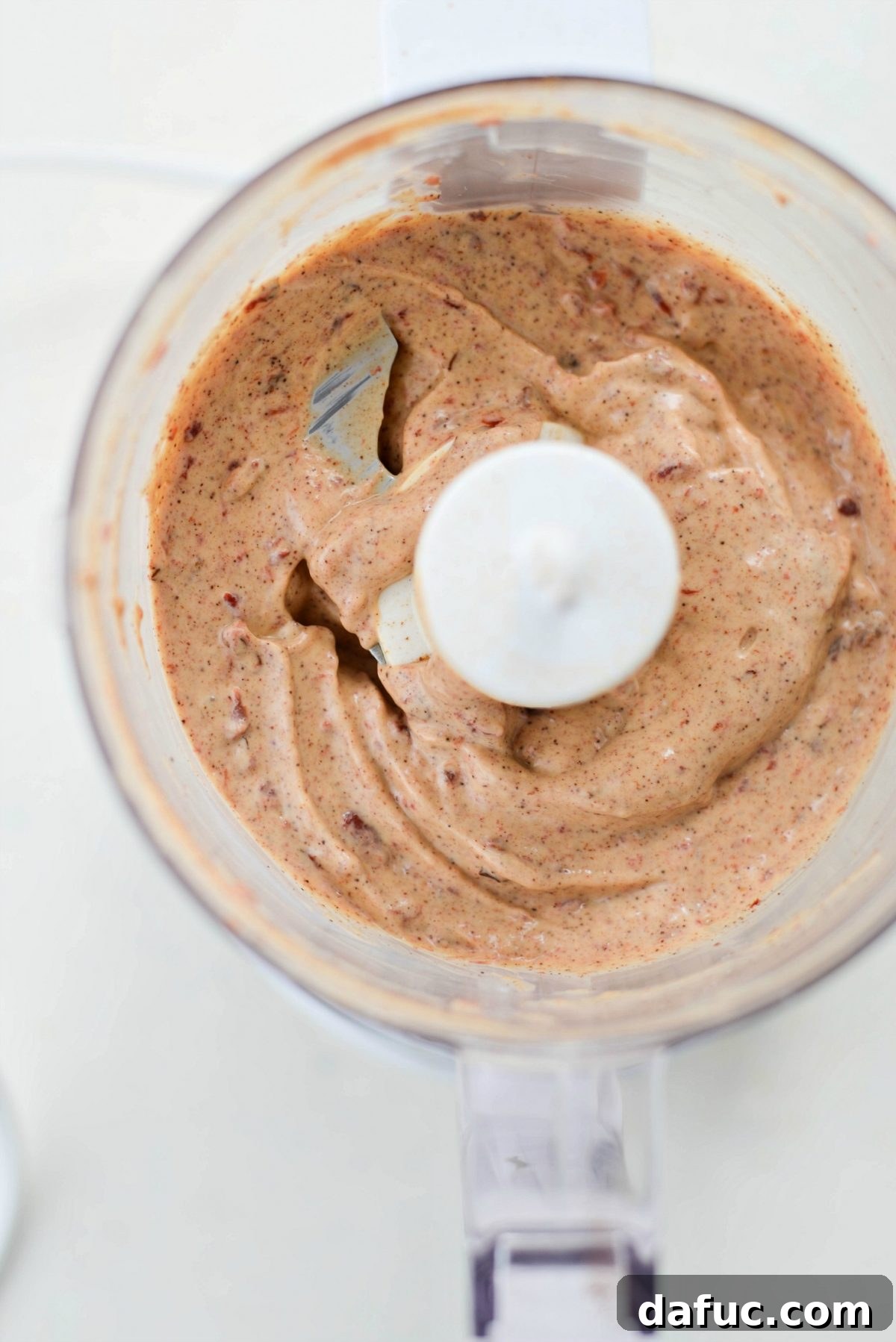 Ingredients for chipotle crema blended smooth in a food processor