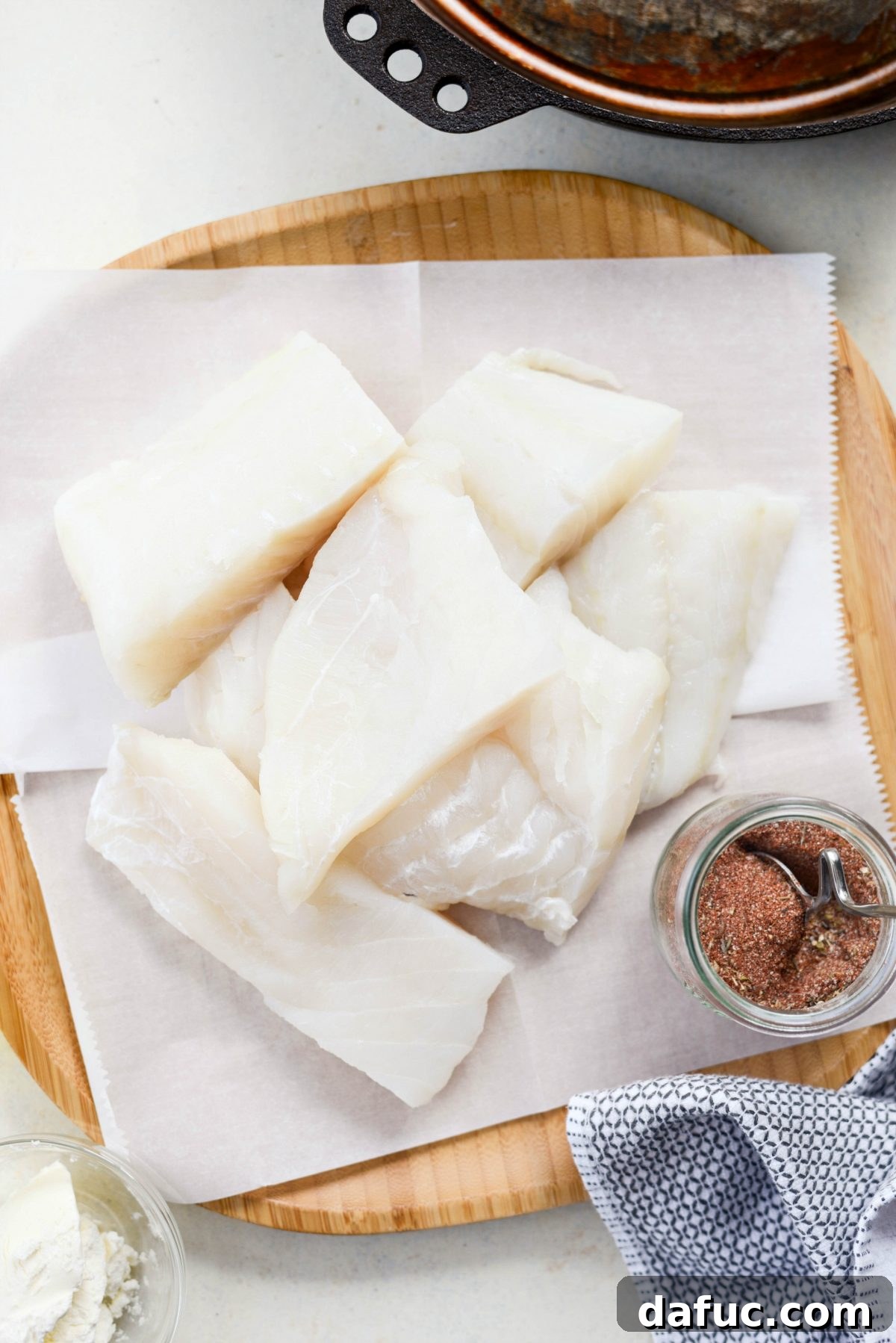 Fresh white fish fillets ready for seasoning and cooking.