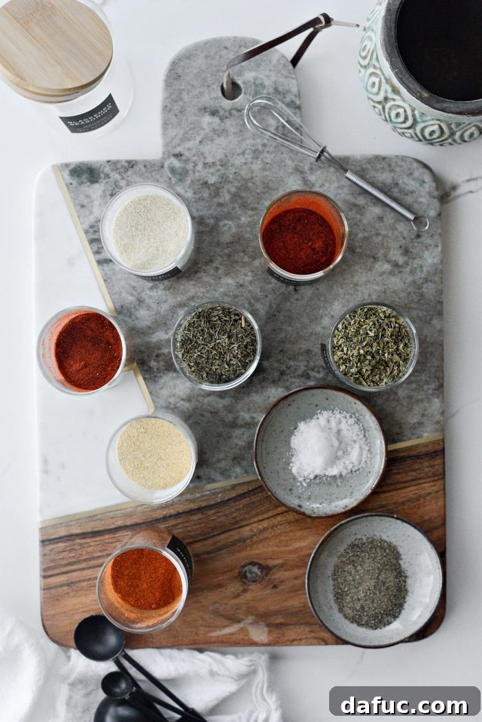 Craft Your Own Blackened Rub 4 All individual dry spice ingredients for Homemade Blackened Seasoning laid out on a clean surface before mixing.