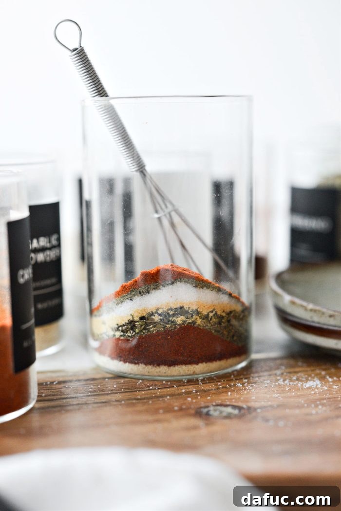 Craft Your Own Blackened Rub 5 Measuring individual spices into a container, one by one, for the Homemade Blackened Seasoning blend.