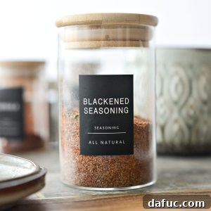 Homemade Blackened Seasoning in a small, labeled jar.