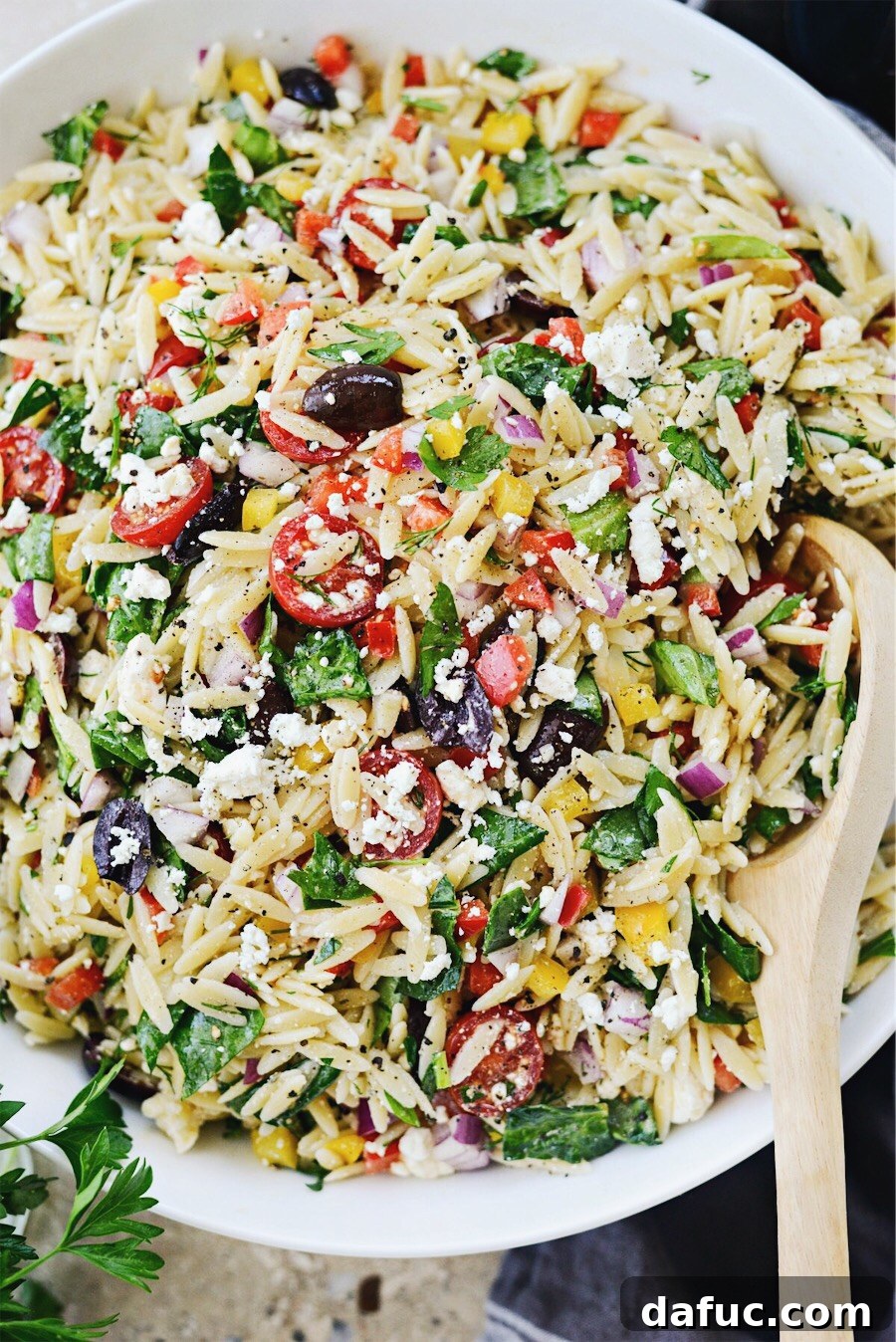 Vibrant Mediterranean Orzo Salad 2 Greek Orzo Salad in white bowl, top-down view