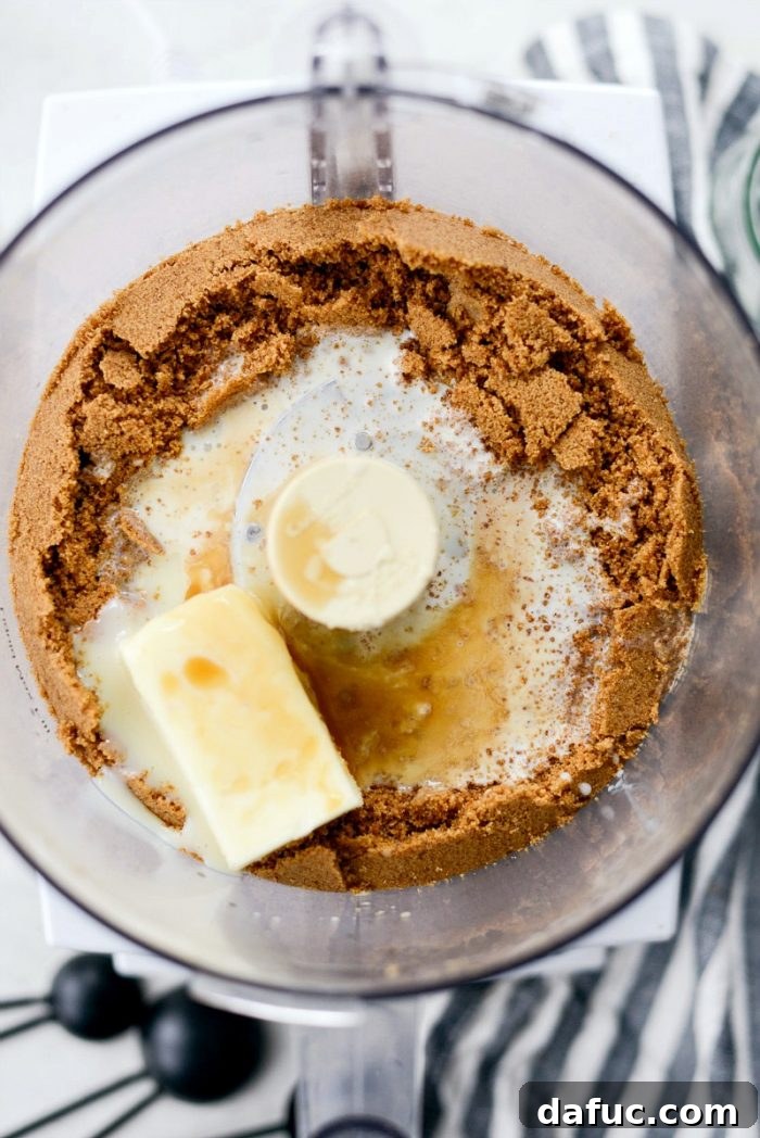 Craft Your Own Speculoos Cookie Butter 7 The food processor actively grinding Speculoos cookies into fine, uniform crumbs.