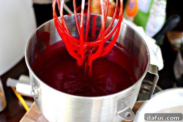 Timeless Red Velvet Cake 16 The intensely vibrant red color of the fully mixed Red Velvet Cake batter, smooth and ready for baking.