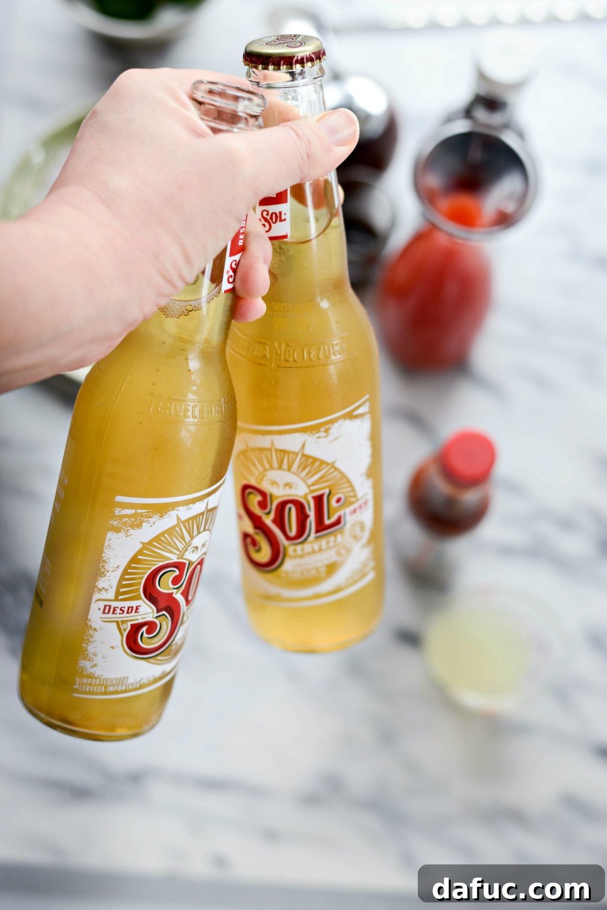 The Ultimate Mexican Michelada Recipe 15 Opening a Mexican beer to pour into the Michelada