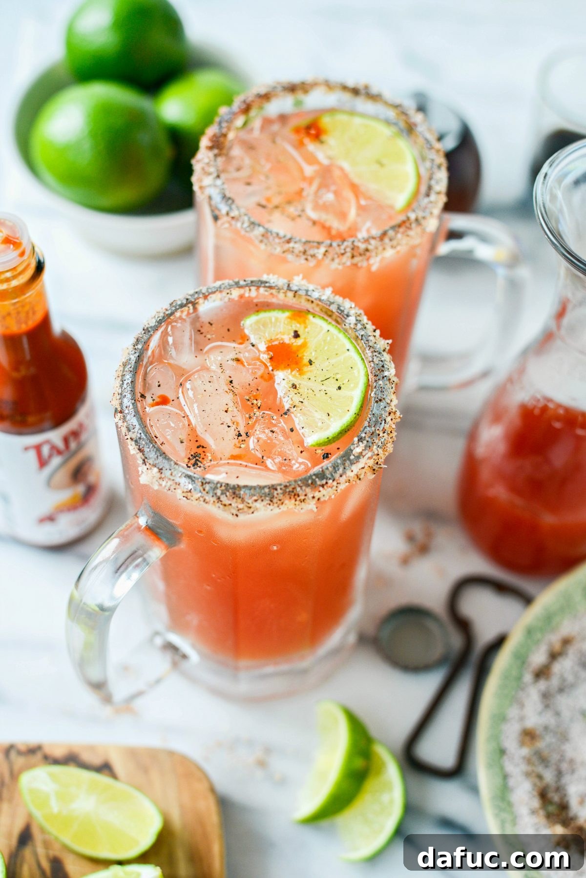 The Ultimate Mexican Michelada Recipe 3 Close-up of a Michelada cocktail in a chilled glass, garnished with lime and a spicy rim