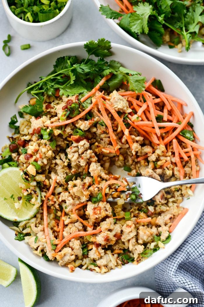 Stylishly presented Thai Chicken Cauliflower Rice Bowl, perfect for a healthy dinner