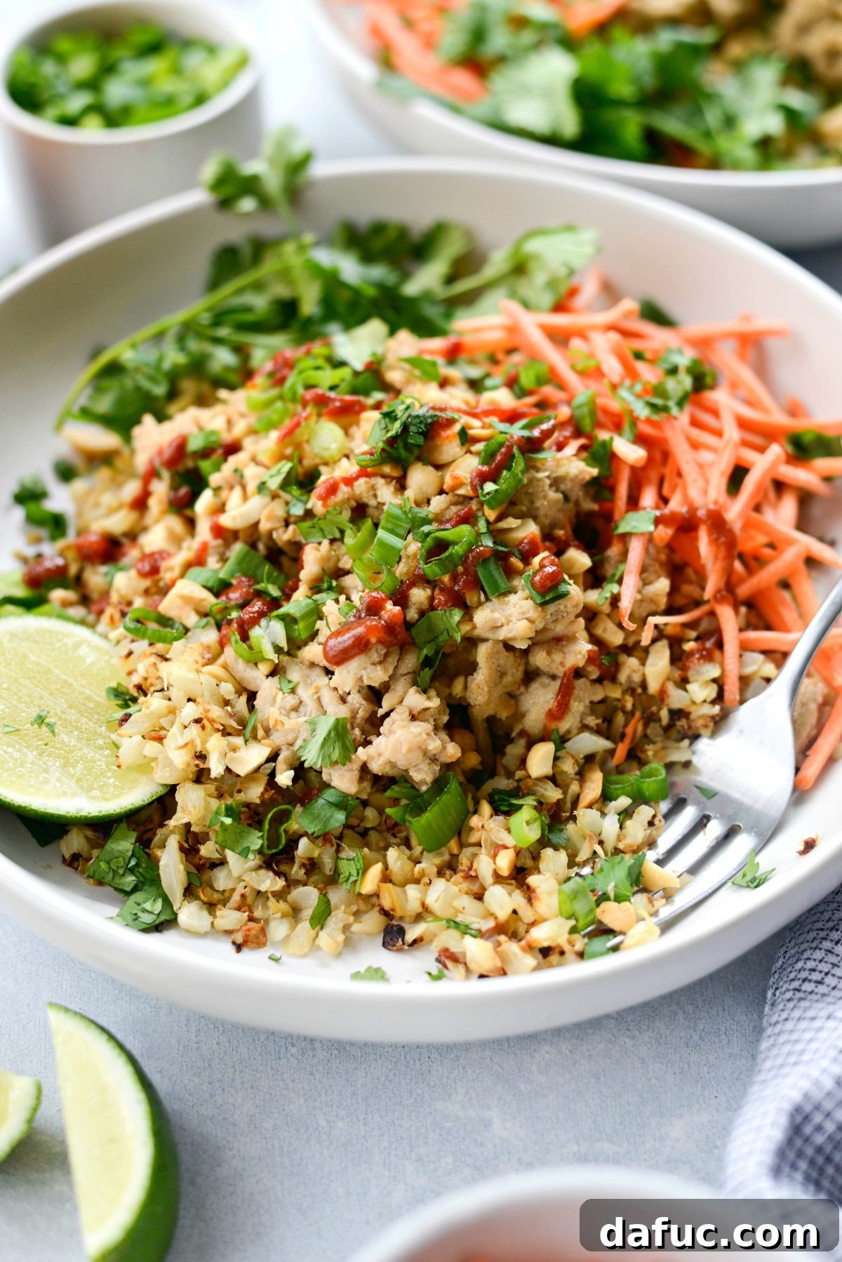 Close-up of a vibrant Thai Chicken Cauliflower Rice Bowl ready to be served