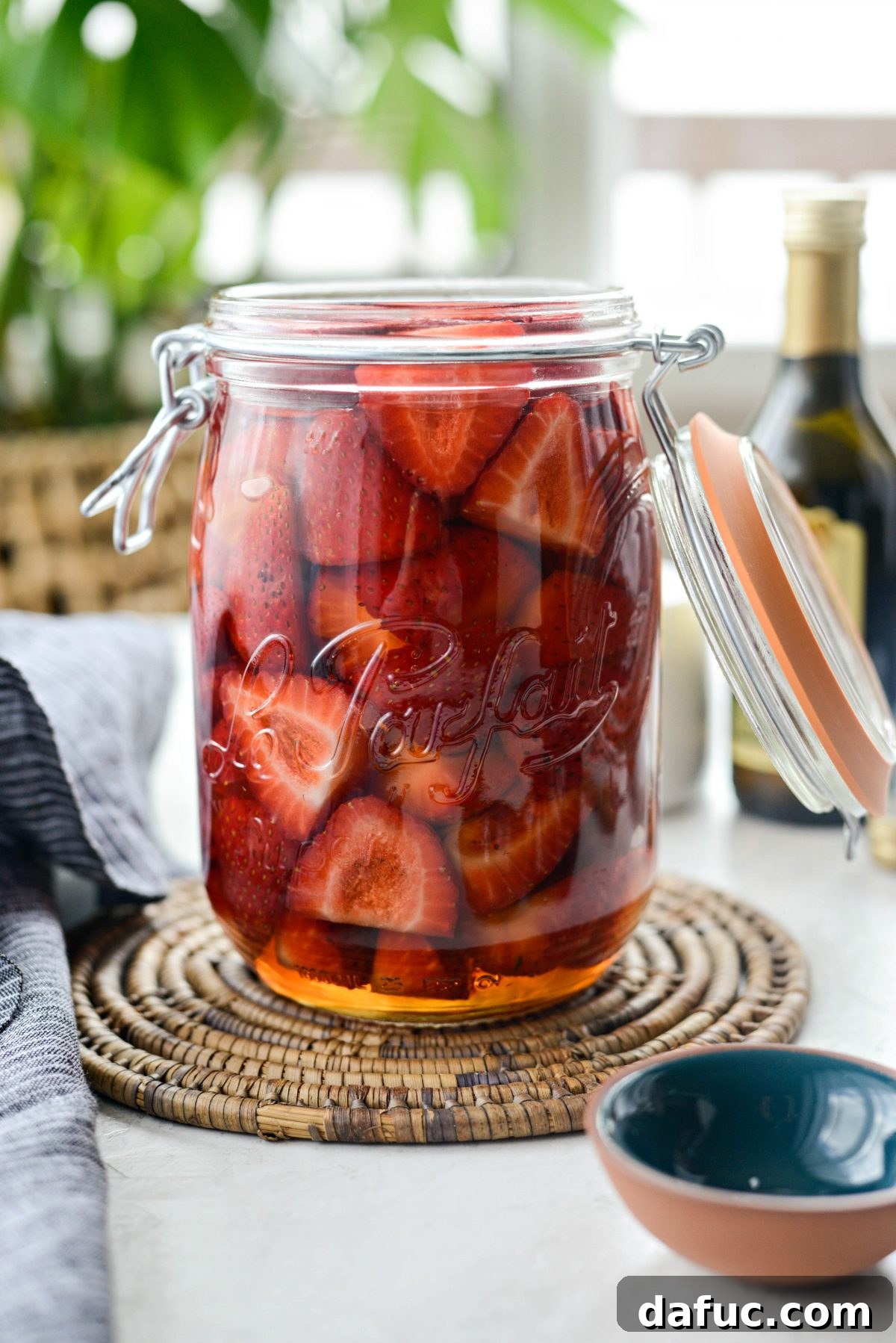 Vinegar-Kissed Strawberries 12 A dish showcasing pickled strawberries, possibly as part of a salad or appetizer.