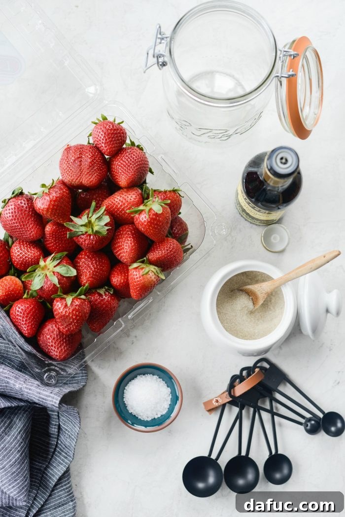 Vinegar-Kissed Strawberries 3 Ingredients for making pickled strawberries, including fresh strawberries, sugar, salt, white balsamic vinegar, and water.