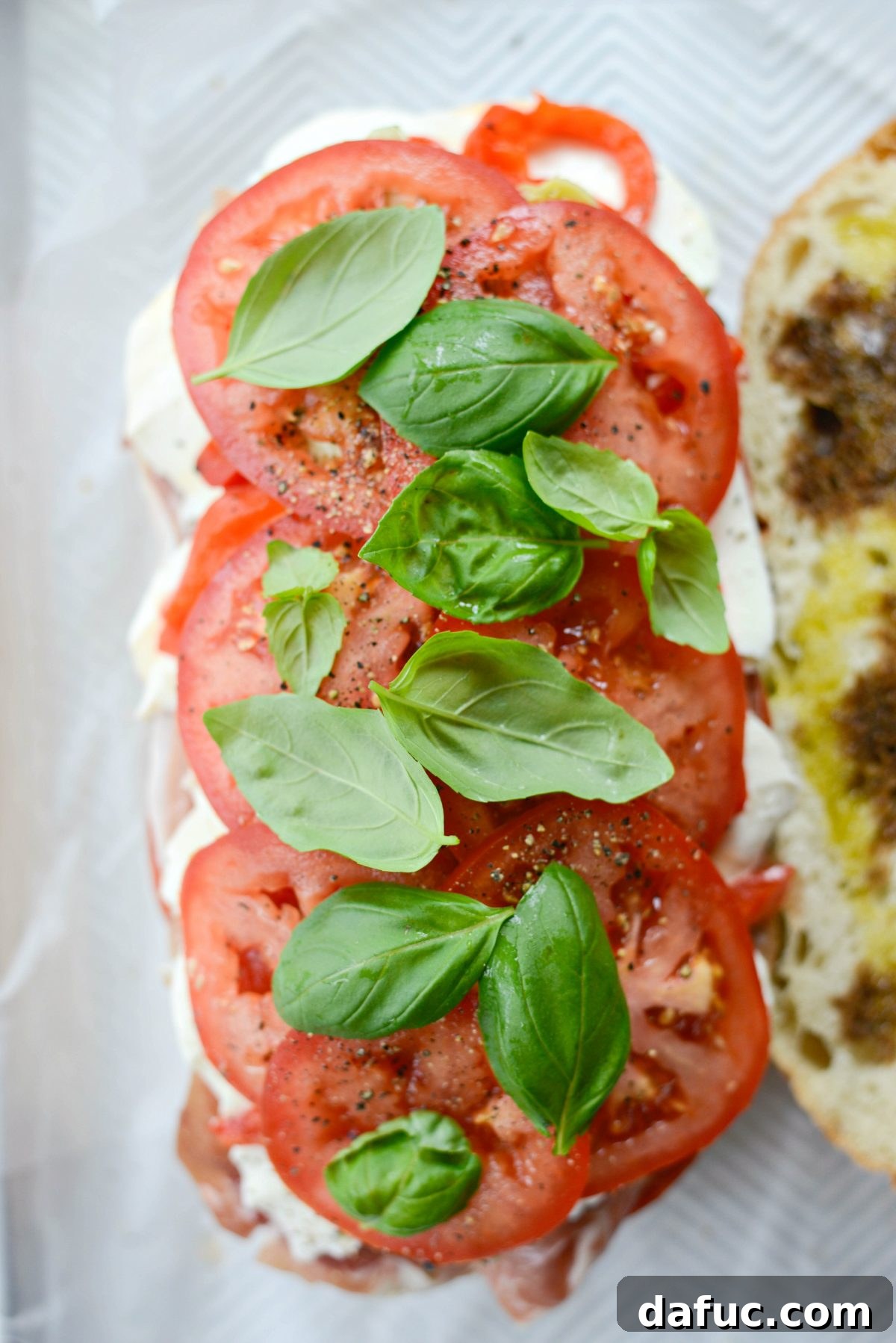 Pressed Italian Perfection 14 Top with fresh basil leaves.