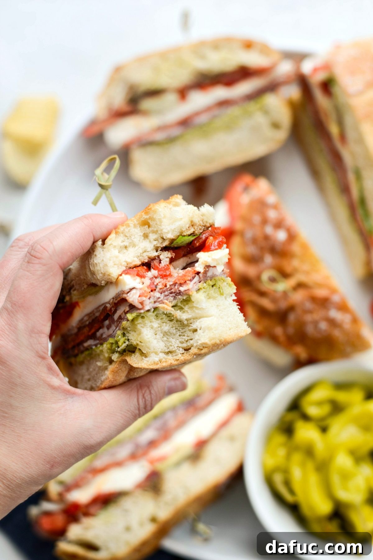 Pressed Italian Perfection 20 A bite of Ultimate Pressed Italian Sandwiches, showcasing its delicious fillings.